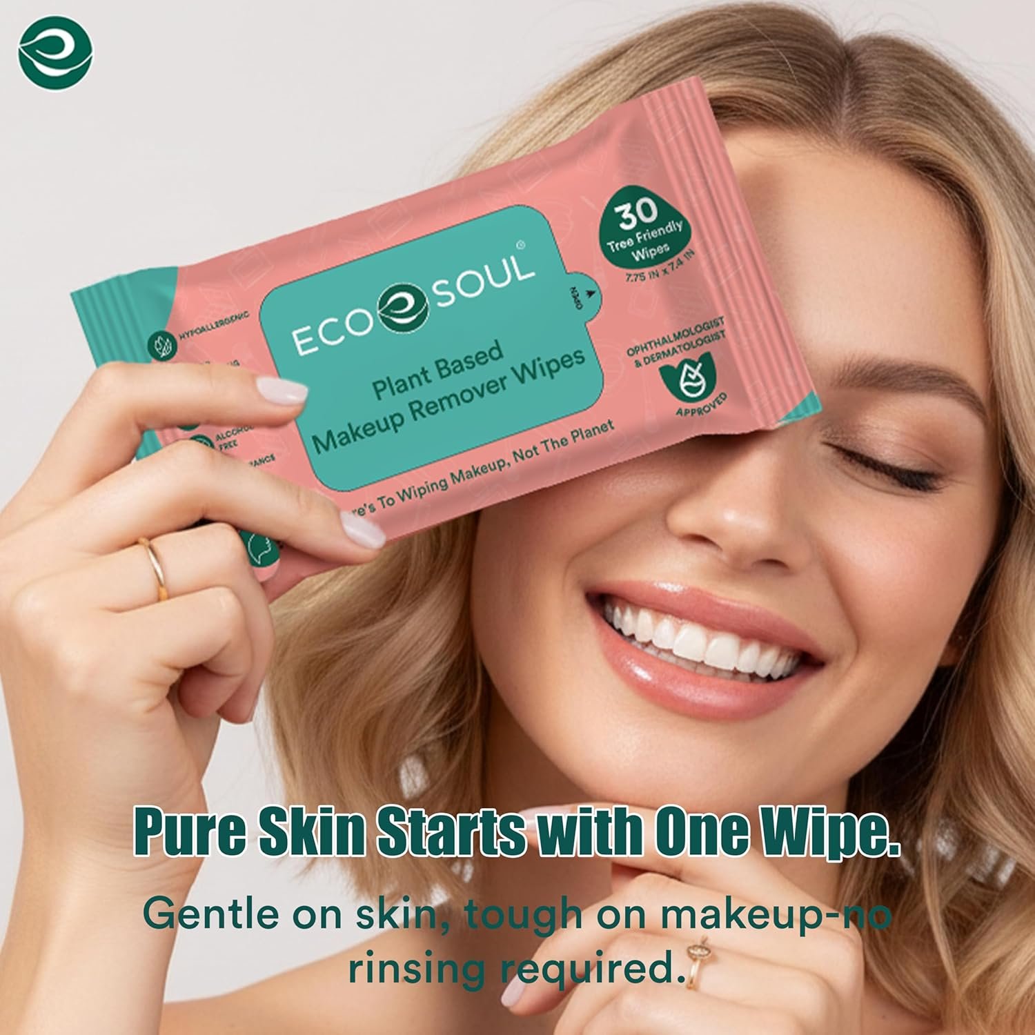 A close-up shot of a soft, textured makeup remover wipe being pulled from a sleek white product packaging.